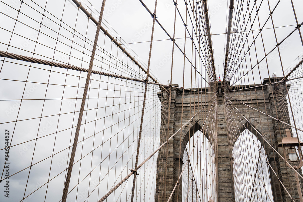 Fototapeta premium Brooklyn bridge. Rainy Brooklyn bridge view. Brooklyn bridge close up view. Rainy day at Brooklyn bridge. 