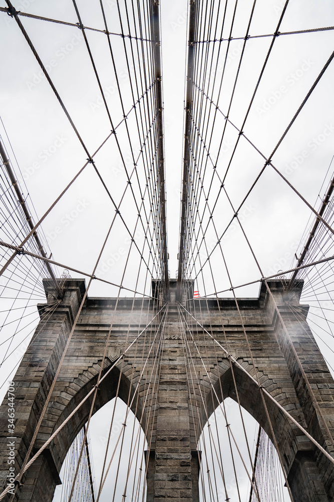 Fototapeta premium Brooklyn bridge. Rainy Brooklyn bridge view. Brooklyn bridge close up view. Rainy day at Brooklyn bridge. 