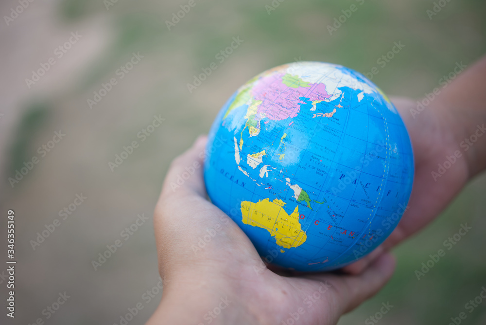 Close up of hand give globe model.Save world concept. Close up of hand give globe model.Save world concept.