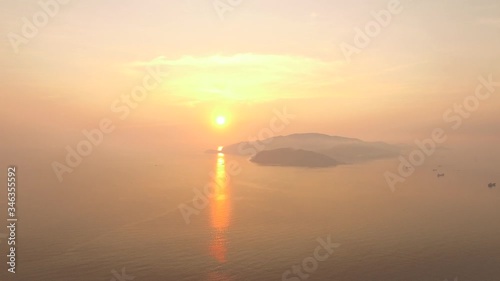 Aerial of amazing sunrise on Hon Tre island, an view from Nha Trang city photo