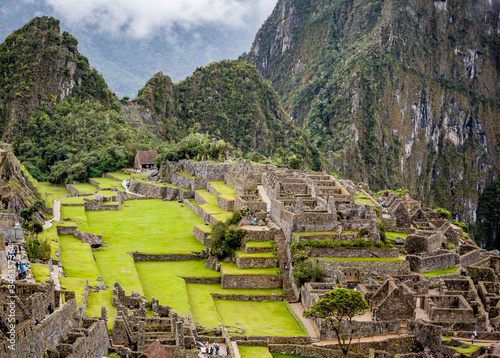 Wide shot of Machu Picchu and extra buildings