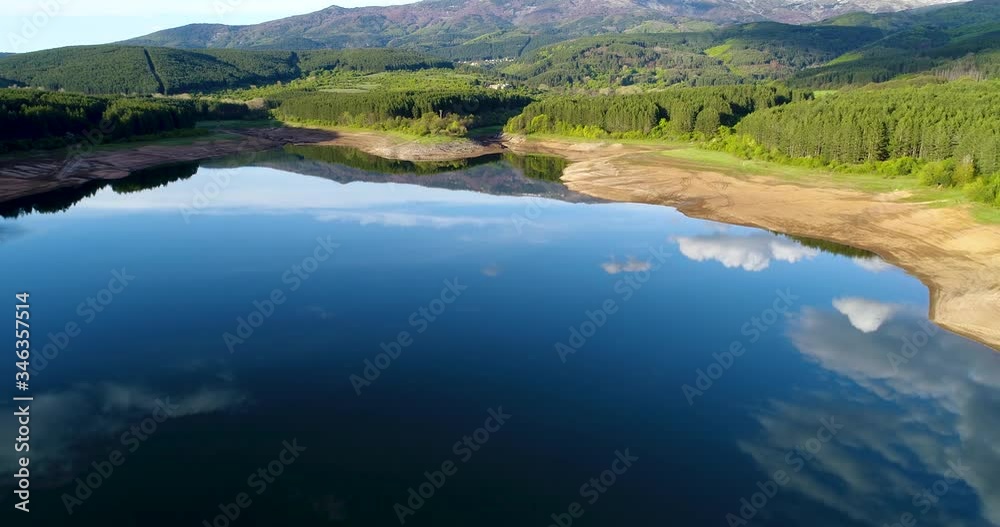 Flying over a lake while the clouds reflect it, very beautiful water-mirror effect, Bulgaria, yaz. Studena.