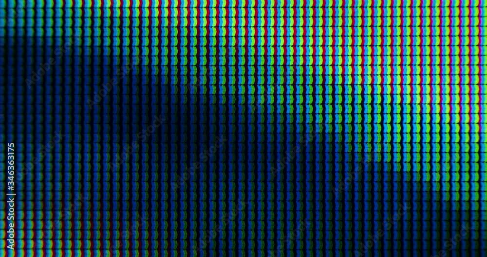 Extreme Close up of Television Screen Pixels, RGB LEDs are Blinking Lights and Emitting Photons from TV
