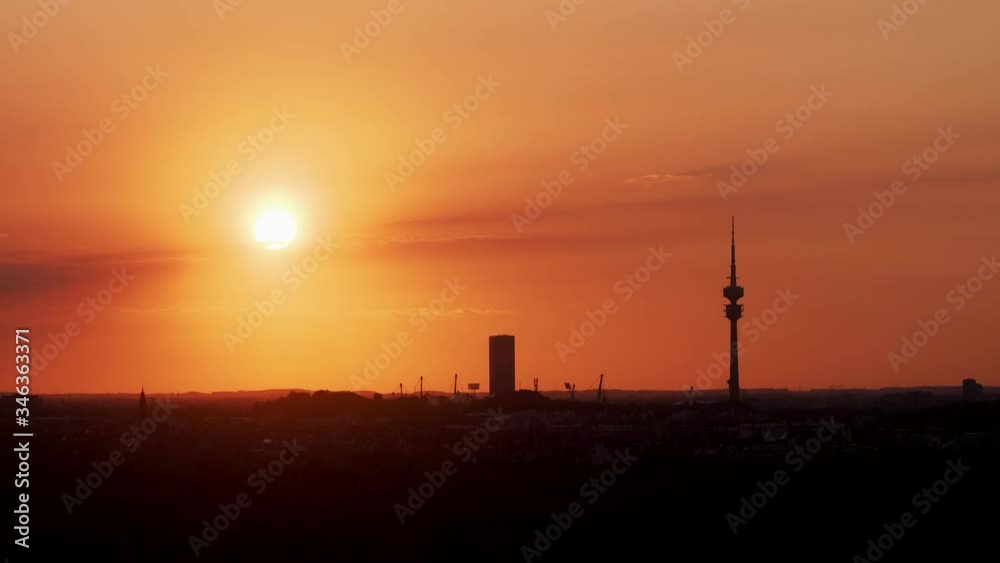 Close timelapse video of sunset above munich with good view of Olympiaturm and Uptown München Tower Close timelapse video of sunset above munich with good view of Olympiaturm and Uptown München Tower