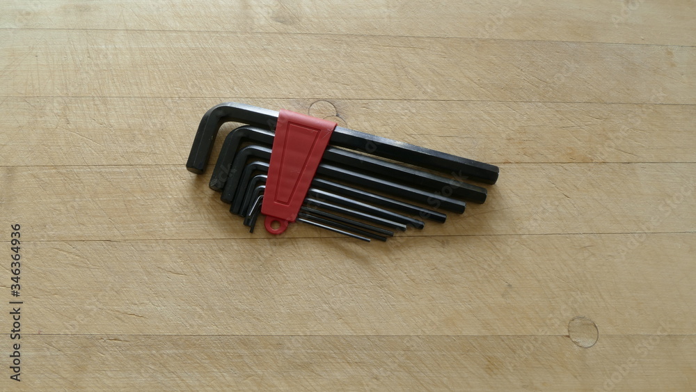 a set of hex keys on a wooden background a set of hex keys on a wooden background