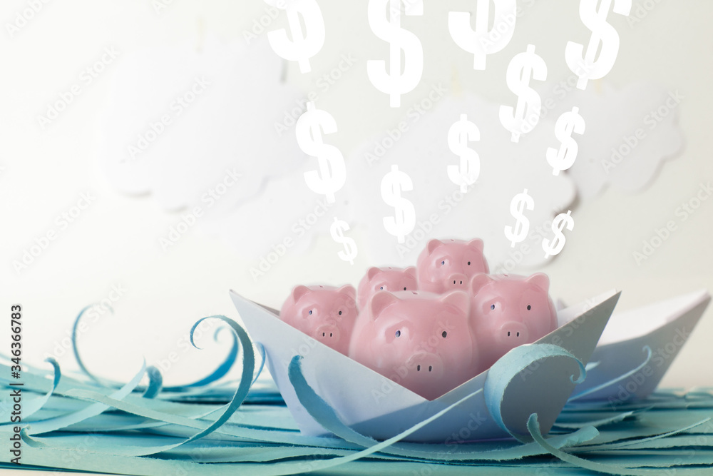Many pink piggy banks and euro floating on paper boats on blue paper sea Many pink piggy banks and euro floating on paper boats on blue paper sea