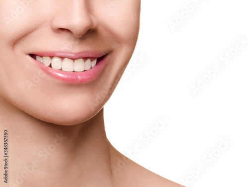 Healthy beautiful female mouth and even teeth, close up. Caucasian woman smile, isolated on white.
