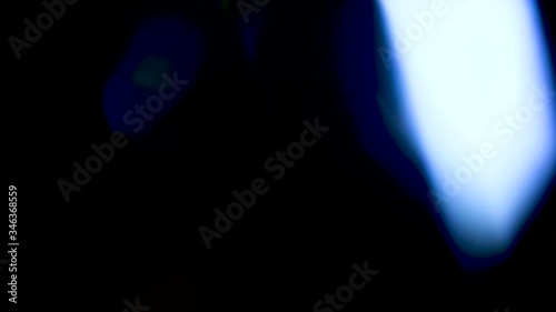 Leaking Reflection of a Glass / Crystal Making Colorful Abstract Prism Figures. Real lens flares perfect for abstract motion background.