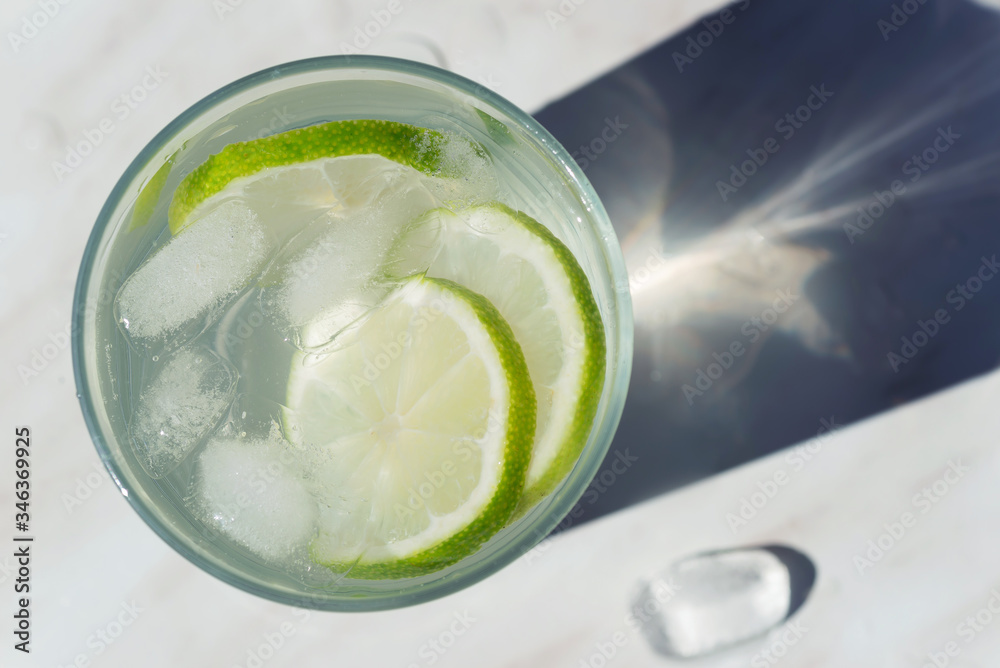 cold lime drink with ice cubes in glass close up cold lime drink with ice cubes in glass close up