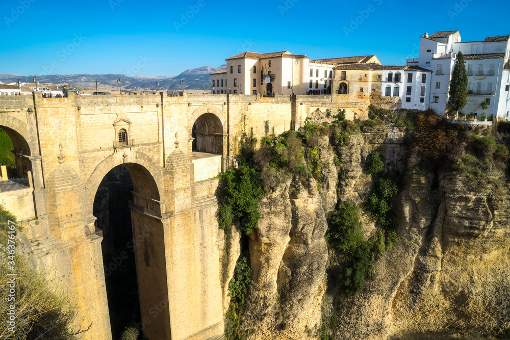 New bridge in Ronda, one of the famous white villages in Andalusia, Spain. The picture was taken during a golden sunset