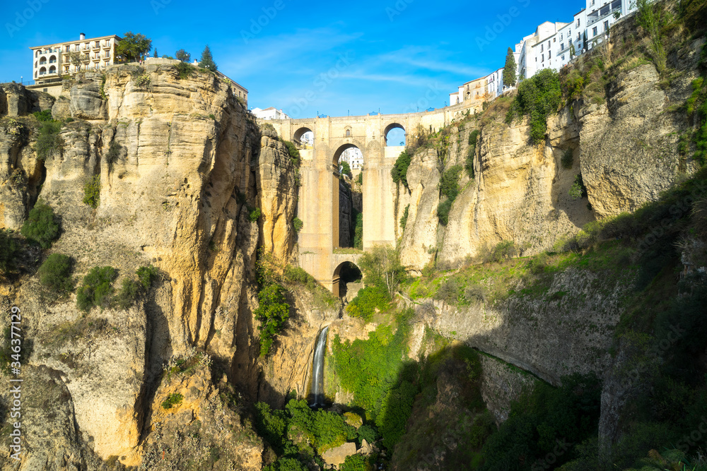 New bridge in Ronda, one of the famous white villages in Andalusia, Spain. The picture was taken during a golden sunset