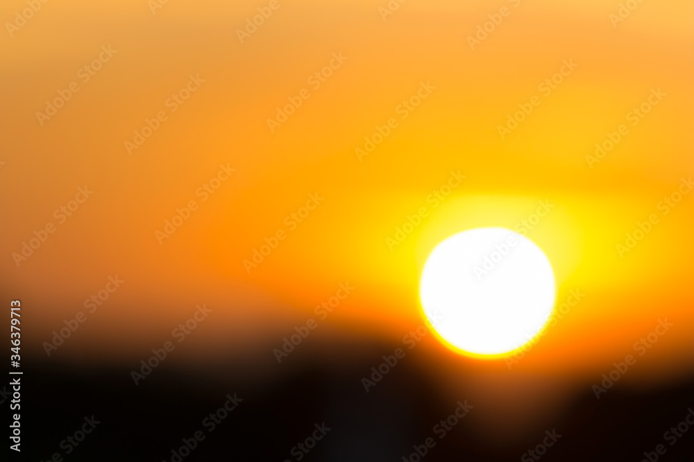 Sun and orange sky  blurred view background