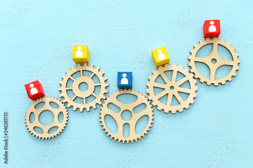 image of colorful blocks with people icons over wooden table ,human resources...