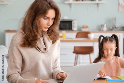 Working mother with little ...