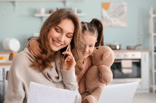 Working mother with little ...