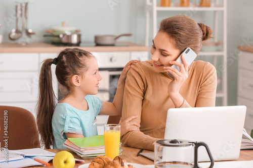 Working mother with little ...