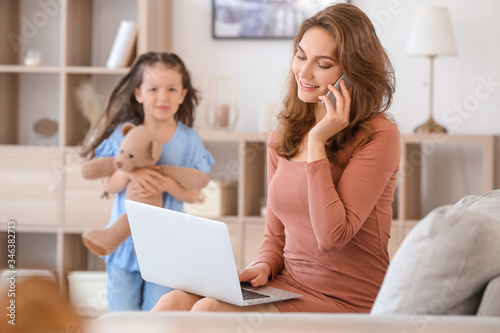 Working mother with little ...