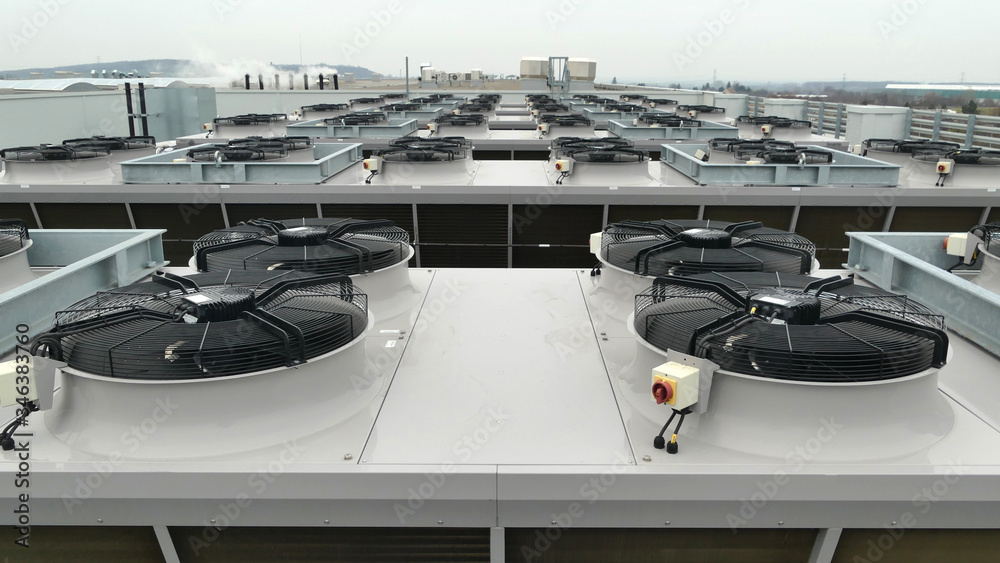 Row of large industrial ammonia NH3 or Co2 condensers on refrigeration system used for cooling chillers and freezers at distribution center
