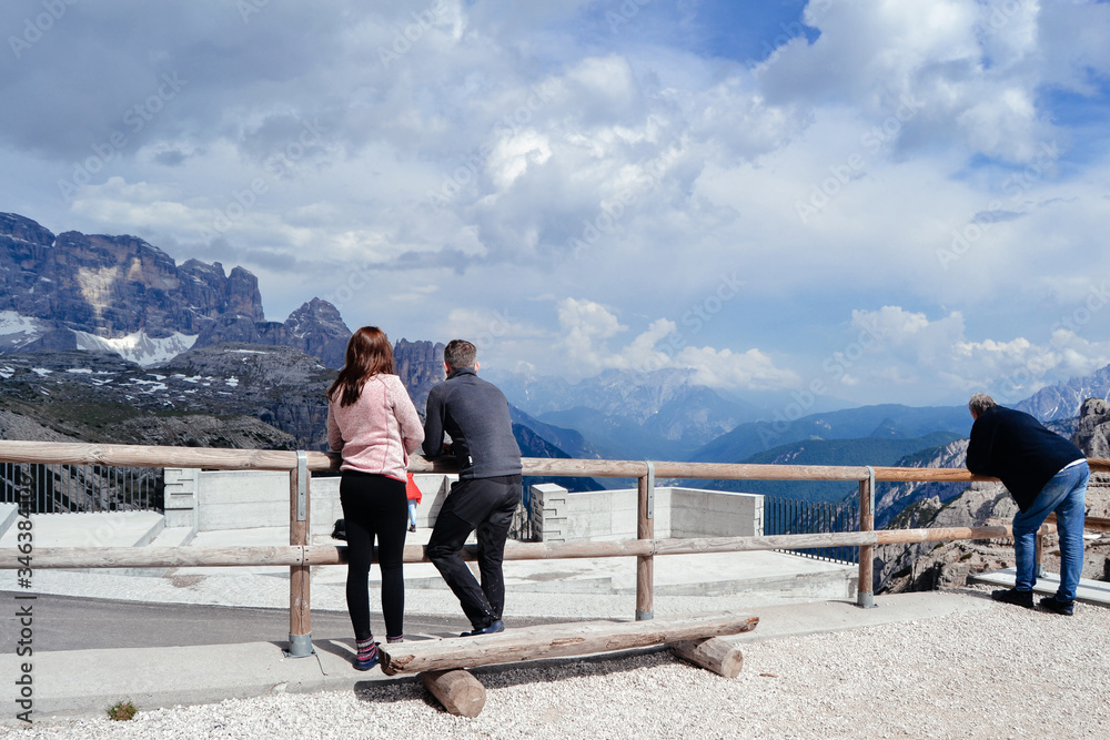 couple looking for amazing mountains view. Dolomites, Italy. couple looking for amazing mountains view. Dolomites, Italy.