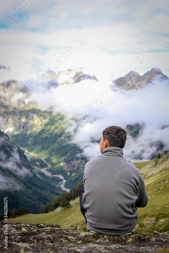 Mountain view with man and clouds