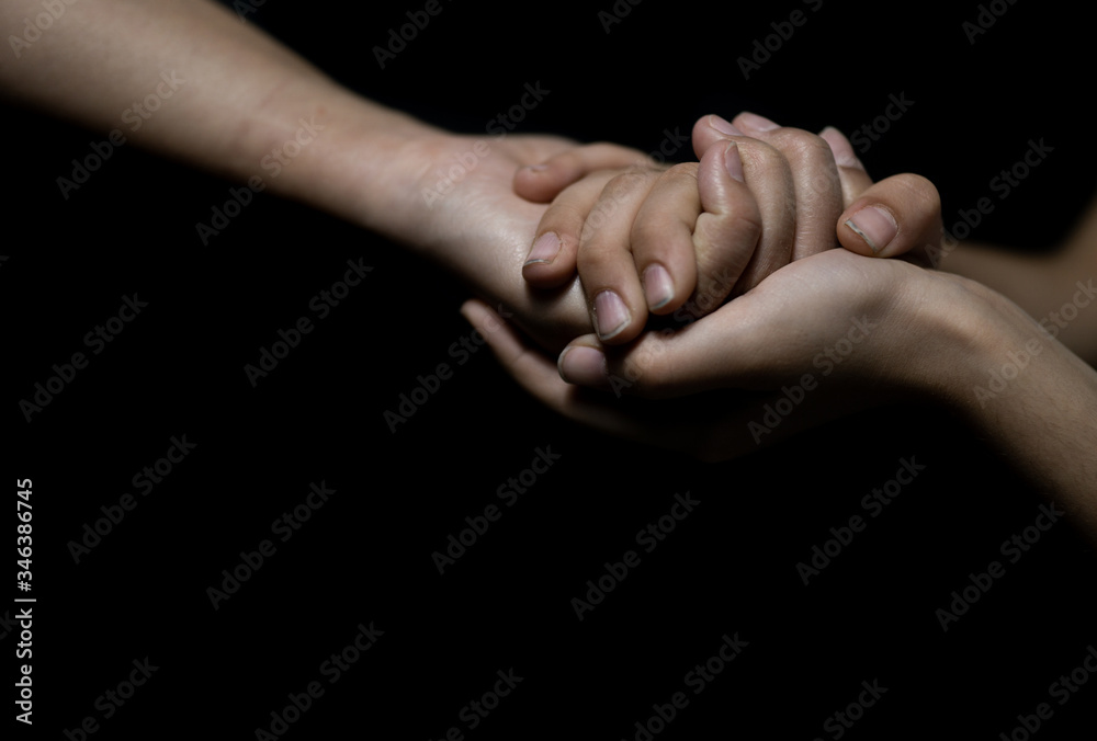 Mother and daughter holding hands. Helping hands.