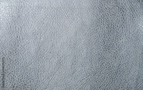Faux leather in metallic white. Artificial leather texture. The concept of snake skin