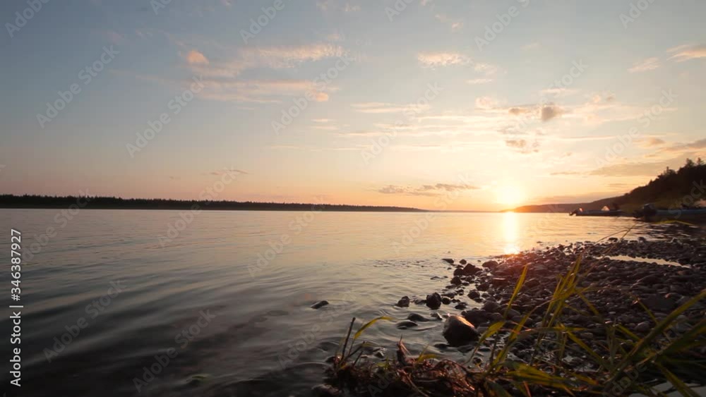 In the Siberian taiga a beautiful sunset on the river coast In the Siberian taiga a beautiful sunset on the river coast