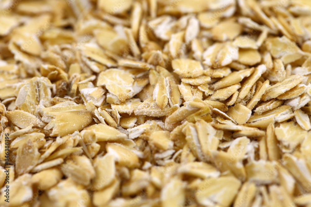 Oatmeal flakes raw in bulk, cereal plants, a healthy breakfast and nutrition concept. Oatmeal flakes raw in bulk, cereal plants, a healthy breakfast and nutrition concept.
