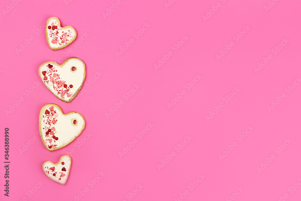 Hand made cookie hearts on a pink background, copy space Hand made cookie hearts on a pink background, copy space