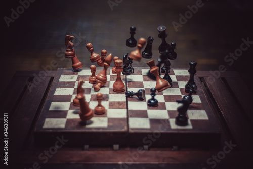 Valokuvatapetti falling chess pieces on the chessboard
