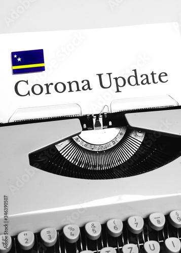 A Typewriter Typing the NEWS of COVID-19 with the Flag of Curaçao.