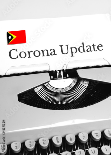 A Typewriter Typing the NEWS of COVID-19 with the Flag of East Timor.
