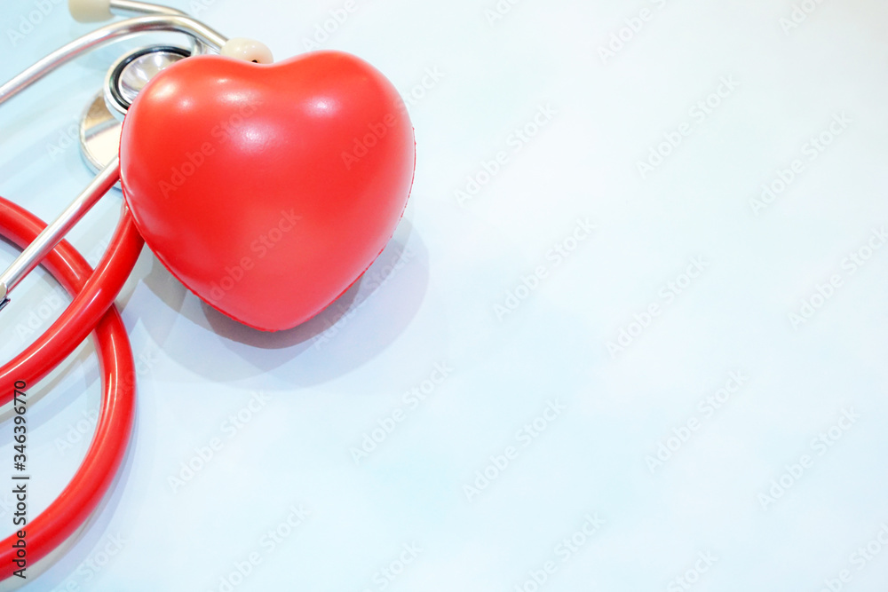 Top view of Red heart and Stethoscope on blue table background. Medical tool doctor or nurse. Cardiology, Check up, Healthcare concept. Copy space.