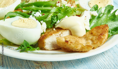 Fotografia Chicken schnitzel Caesar