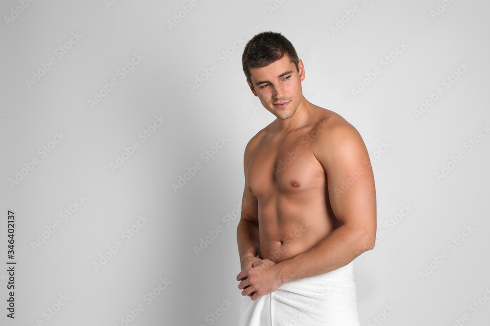 Man with sexy body on light background. Space for text