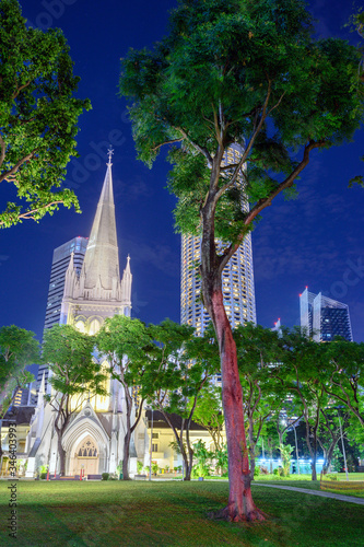 Singapore, St. Andrew's Cathedral at night, in the background Swissôtel The Stamford photo