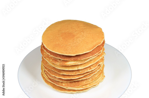 Closeup stack of homemade pancakes on white plate isolated on white background