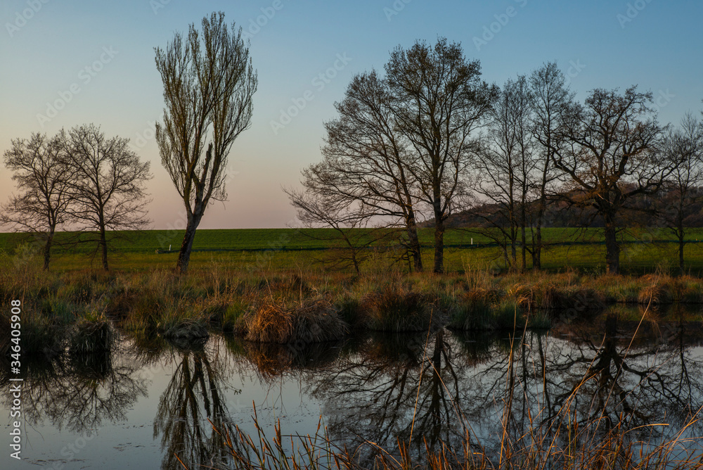 Sunset on the lake near the village of Stadel in Switzerland in spring Sunset on the lake near the village of Stadel in Switzerland in spring