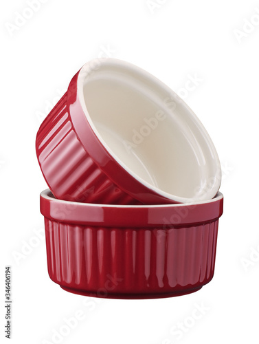 Two red round empty porcelain ramekin on a white background