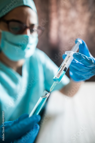 Nurse holding a syringe with the coronavirus COVID-19 vaccine