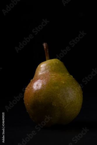 pear on a black background
