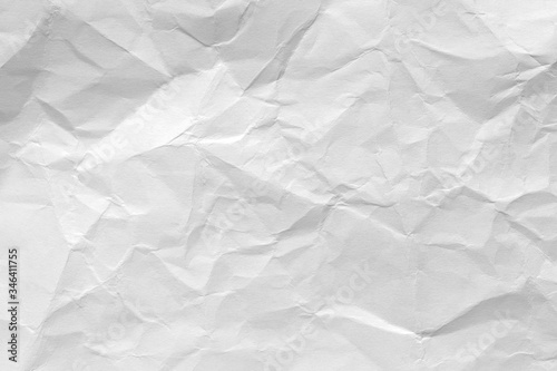 White crumpled paper background, texture old for web design screensavers. Template for various purposes or creating packaging.