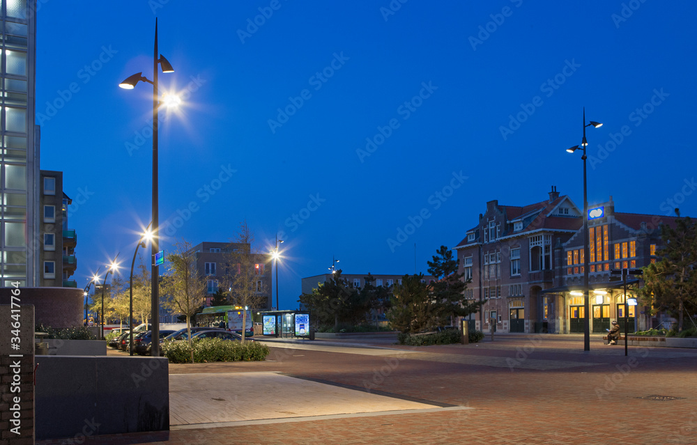 Modern lamp posts at night. Twilight, Trainstation Zandvoort Netherlands.