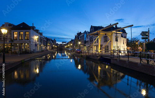 City of Schiedam at night. Twilight. Draw bridge and canal