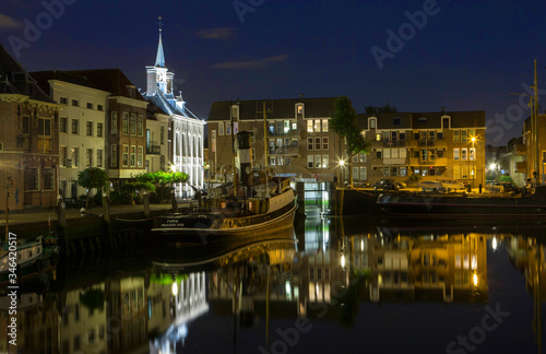 City of Schiedam at night. Twilight. Harbour and boats