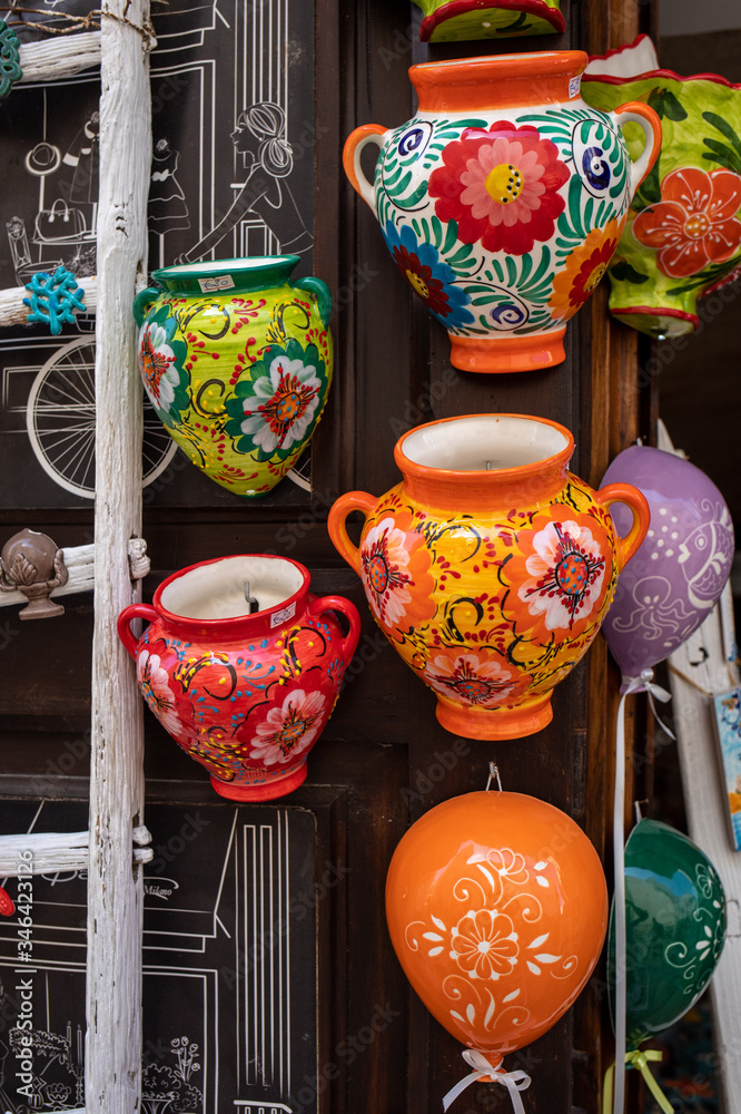 Hand-painted colorful traditional ceramics at a shop display in Polignano a Mare. Apulia. Italy