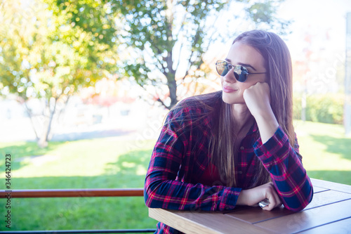 Young woman with sunglasses...