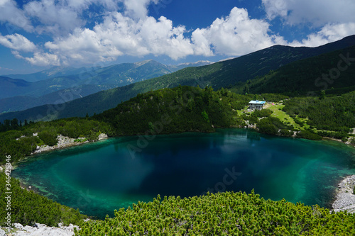 View towards Sinanitsa lake and refuge from the peak in Pirin mountain National park in Bulgaria 