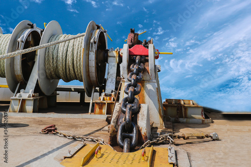 Obraz na plátně Mooring winch, Mooring windlass rope anchor at Deck ship forward in shipyard on blue sky background