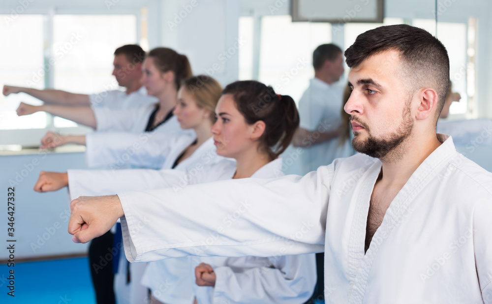 Fototapeta premium trainees expressing interest in attending karate class